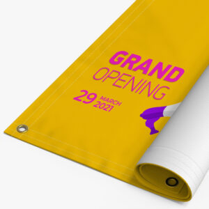 Rolled 13oz vinyl banner printed with a grand opening message and brass grommets